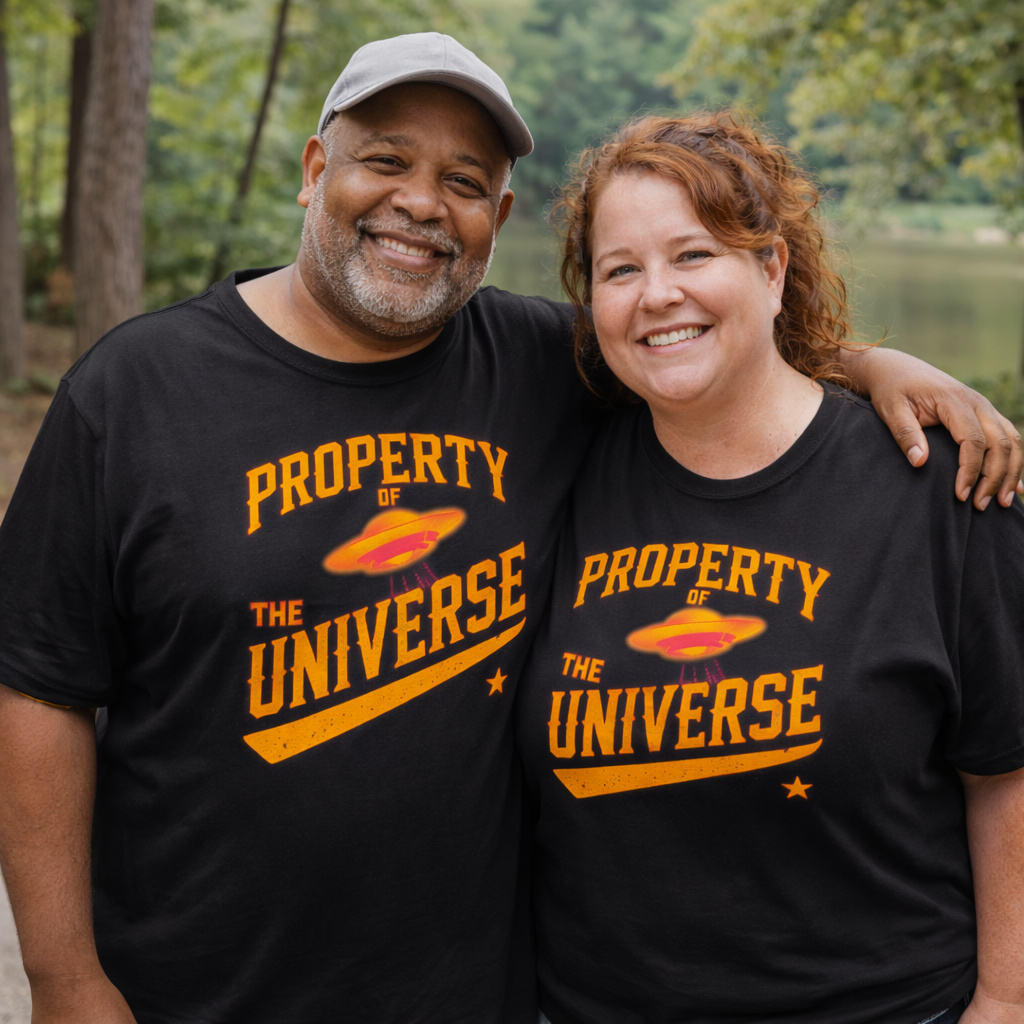 Two people wearing black t-shirts with 'Property of the Universe' text and a UFO graphic.